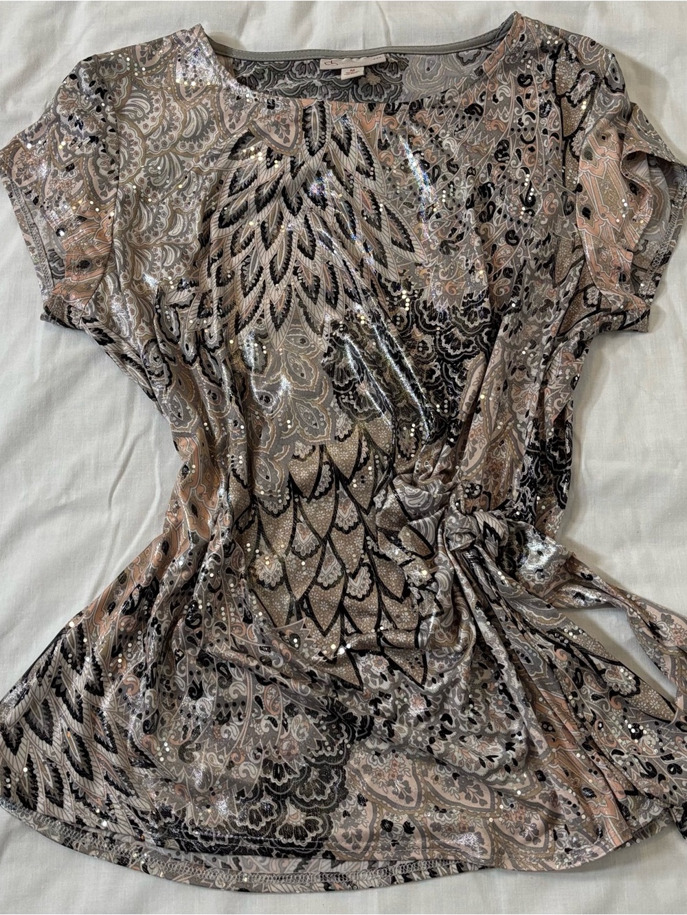 Woman’s silver sequins blouse with waist tie
